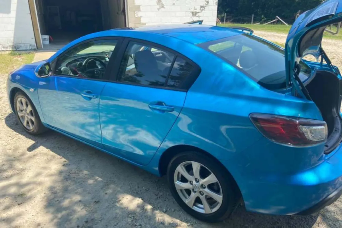 Detailed blue car with doors and trunk open
