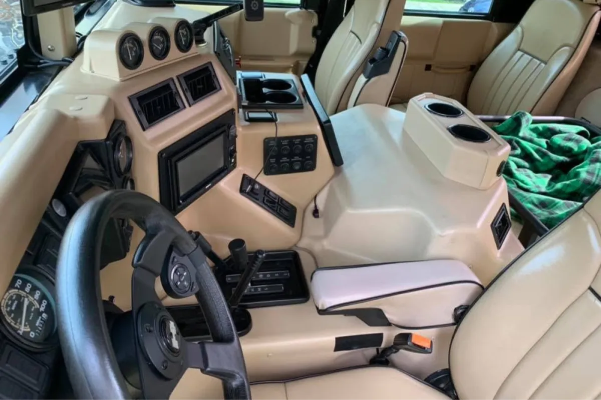 Detailed beige rear seats with a clean leather finish.