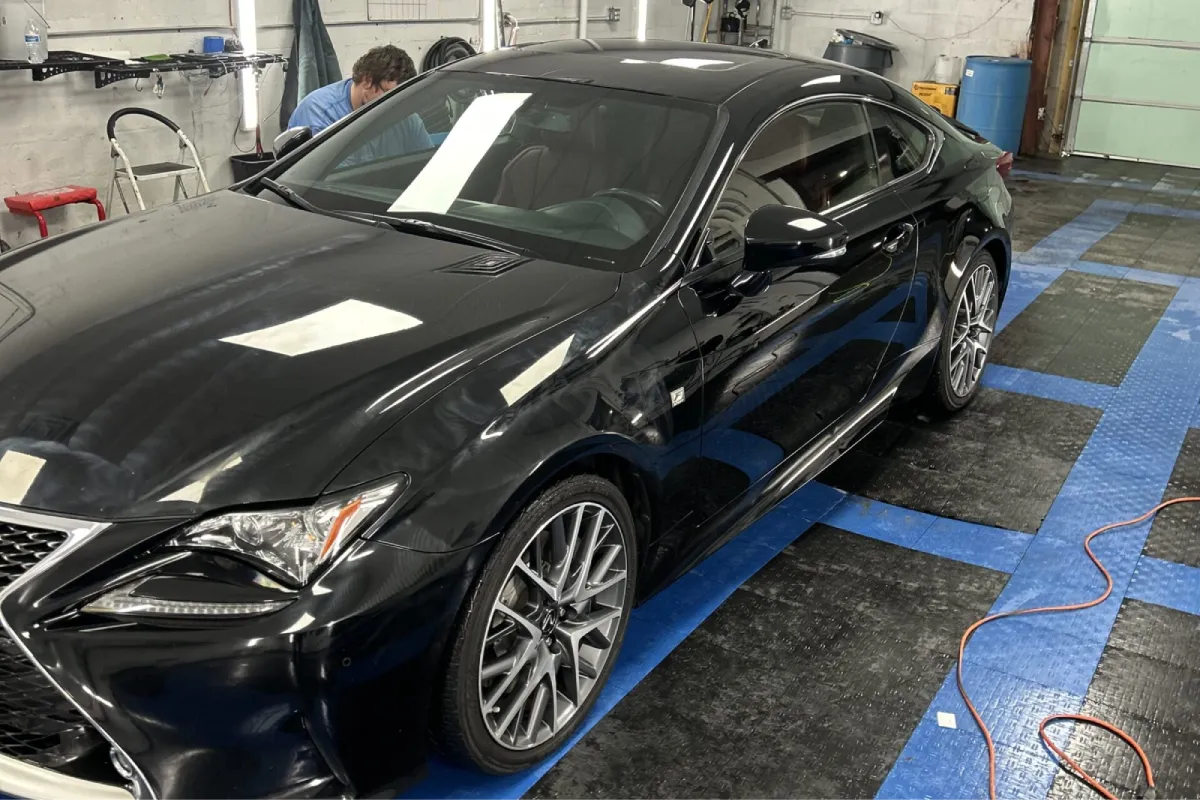 Black Lexus sedan with professionally tinted windows.
