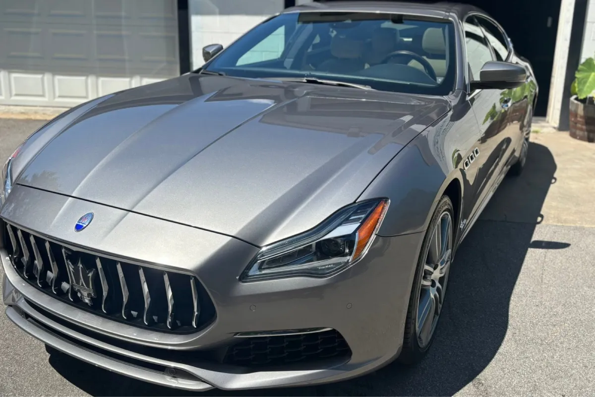 Silver Maserati with a glossy finish after paint correction.